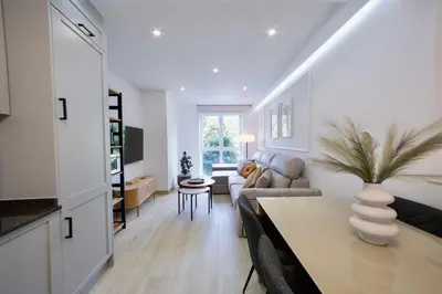 a living room with a couch and a table at Rosalia Park by Lugo Collection in Lugo