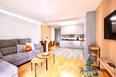 a living room with a couch and a table at Rosalia Park by Lugo Collection in Lugo