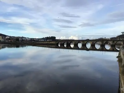 a body of water with a city in the background at Piso en el centro de Viveiro in Viveiro