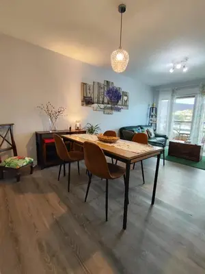 a kitchen with white cabinets and a counter top at Piso en el centro de Viveiro in Viveiro