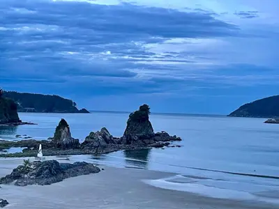 a view of a beach with rocks in the water at Covas Home in Viveiro