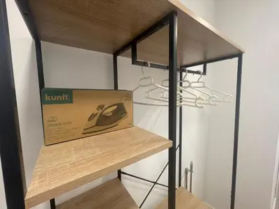 a box sitting on a shelf next to a lamp at Céntrico apartamento muralla 2 in Lugo