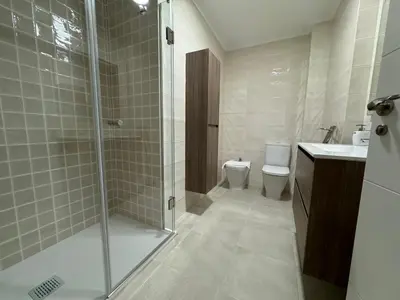a bathroom with a shower and a toilet at Neypa Liberdade in Sarria