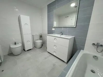 a bathroom with a sink and a toilet and a mirror at Neypa Liberdade in Sarria