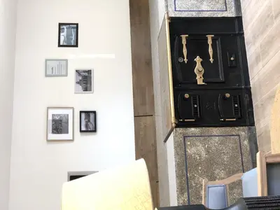 a room with a black door with pictures on the wall at CASA DO QUEIXEIRO in Castroverde