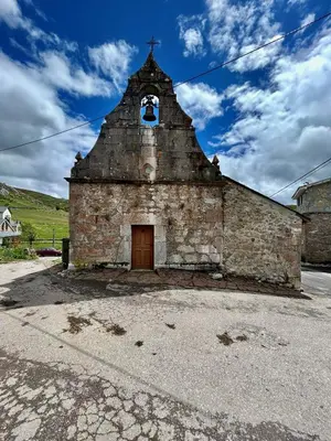 a group of buildings with mountains in the background at Coronel Somiedo by Unusual Hotels in El Puerto de Somiedo