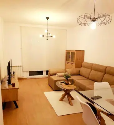 a living room with a couch and a table at Taboada Sacra Home in Taboada
