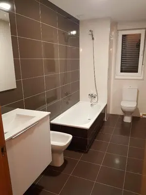 a bathroom with a toilet and a tub and a sink at Taboada Sacra Home in Taboada