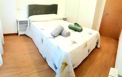 a bedroom with a bed with two pillows on it at Taboada Sacra Home in Taboada