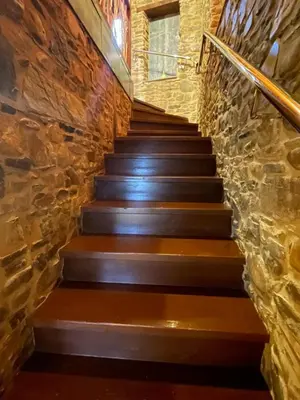 a set of stairs in a stone wall at Alojamiento bodega LOF in Valtuille de Abajo