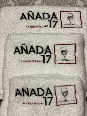 three towels with the words amanda andaria on them at Añada17 in Monforte de Lemos
