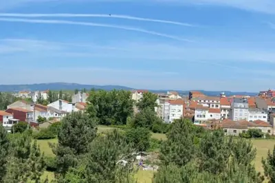 a view of a city with houses and trees at Añada17 in Monforte de Lemos