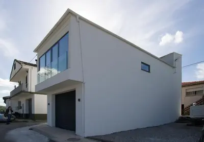 a white house with a large window at Casa Tome A Teixeira - Ribeira Sacra in Teixeira