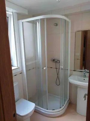 a bathroom with a shower and a toilet and a sink at Piso en Betanzos in Betanzos