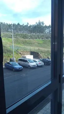 a group of cars parked in a parking lot at Piso Encanto Palmeiro in Jove