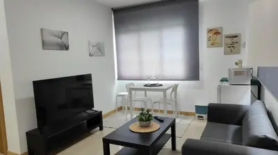 a living room with a couch and a table at LAR de Yago - Habitación Ribadeo in Ribadeo