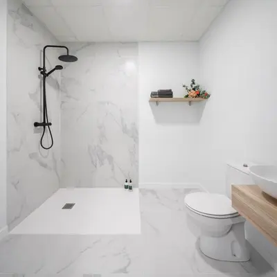a white bathroom with a toilet and a sink at Luxury Singular Apartments Orange in Santiago de Compostela