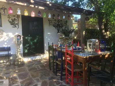 a table and chairs in front of a house at Casa A Boga RIBEIRA SACRA in Abeleda