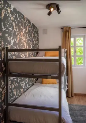 a bedroom with two bunk beds in a room at Burgas1 in Ourense