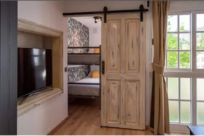 a room with a bunk bed and a sliding door at Burgas1 in Ourense