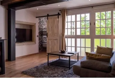 a living room with a couch and a table at Burgas1 in Ourense