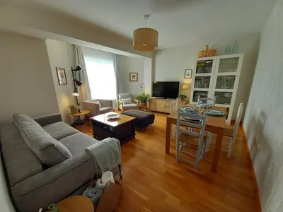 a living room with a couch and a table at Abrula Vilalba in Villalba