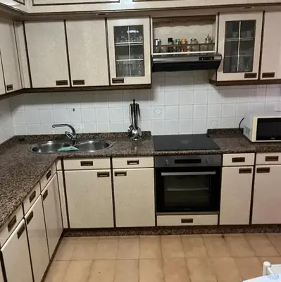 a kitchen with a sink and a stove at PISO ARTUR rúa astureses in Carballino