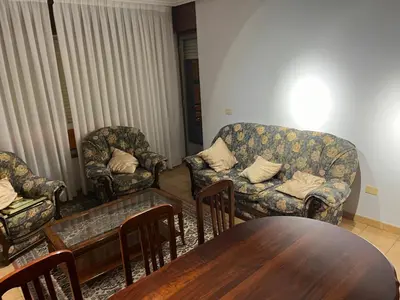 a living room with two chairs and a table at PISO ARTUR rúa astureses in Carballino