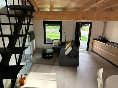 a living room with a couch and a table at Casa Fernanda-Ribeira Sacra in Covas