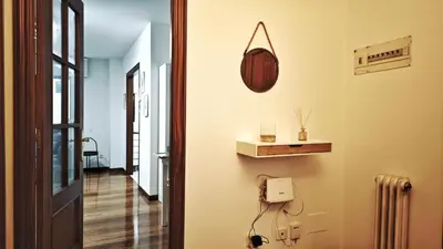 a hallway with a room with a door and aperature at Piso céntrico Santiago de Compostela con terraza y parking in Santiago de Compostela