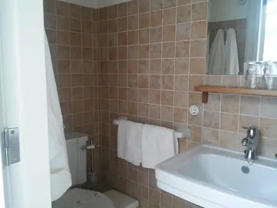 a bathroom with a toilet and a sink at Pensión con Encanto San Martiño Pinario in Santiago de Compostela