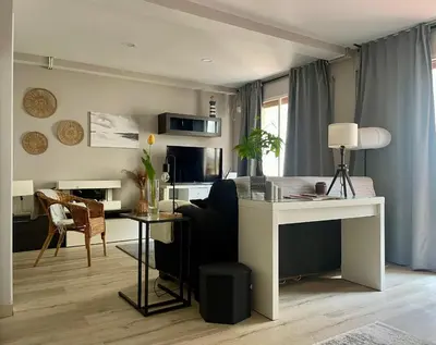 a living room with a couch and a table at Alojamiento D'Moda in Ribadeo