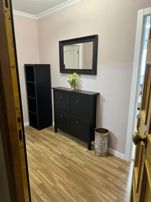 a bedroom with a black dresser and a mirror at Serendipia in Villalba