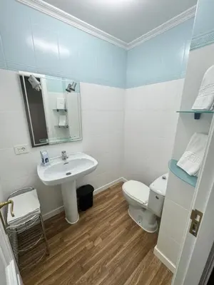 a bathroom with a sink and a toilet at Serendipia in Villalba