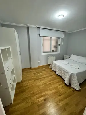 a small bedroom with a bed and a window at Serendipia in Villalba