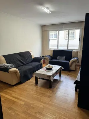 a living room with two couches and a coffee table at Serendipia in Villalba