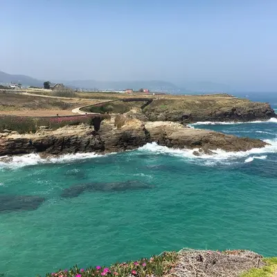 a view of the ocean with a rocky coastline at El Rincón Del Silencio in Moucide
