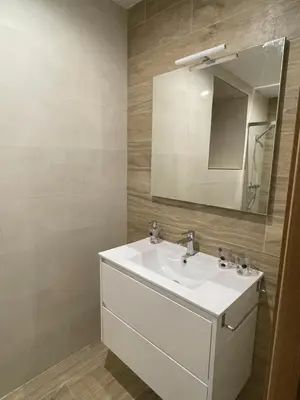 a bathroom with a white sink and a mirror at Eira do Xastre in Brocos