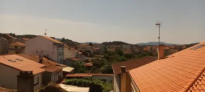 an aerial view of a city with roofs at Fogar da Fraga in Caldas de Reis