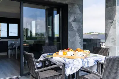 a table with a tray of food on a balcony at El Cañon By Silastur in El Espín