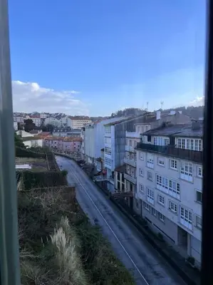 a view of a city with buildings and a street at Casa con terraza en el casco in Betanzos