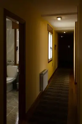 a hallway of a bathroom with a sink and a tub at Braida Ribeira Sacra in Sober