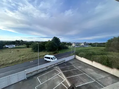 a white van is parked on a highway at S&H La Gaita in Foro