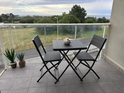 a table and chairs on a balcony with a view at S&H La Gaita in Foro