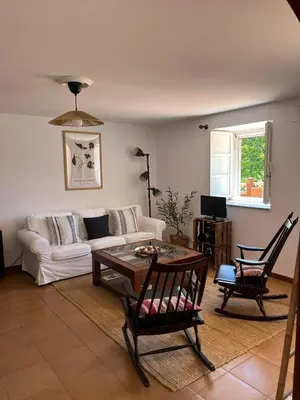 a living room with a couch and a table at Casa Germán in A Coruña