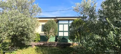 a house with trees in front of it at Casa Mercedes in Quiroga