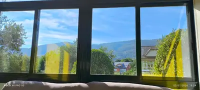 a window with a view of a mountain view at Casa Mercedes in Quiroga