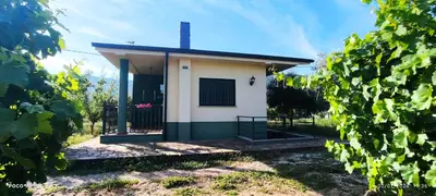 a small building with a door in a field at Casa Mercedes in Quiroga