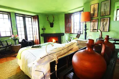 a bedroom with a bed and a fire place at Te Cuento 3 Xesteira in A Xesteira