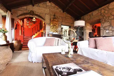 a living room with a couch and a table at Te Cuento 3 Xesteira in A Xesteira